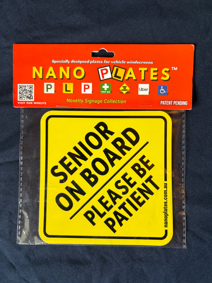 Yellow 'Senior on Board Please Be Patient' sign in packaging with Nano Plates branding.